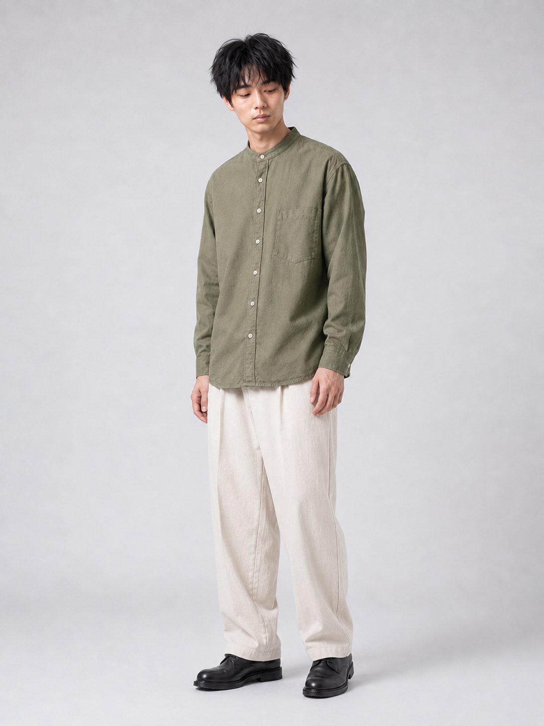 [color:army-green-m11] Band-collar shirt, contemplative editorial model view