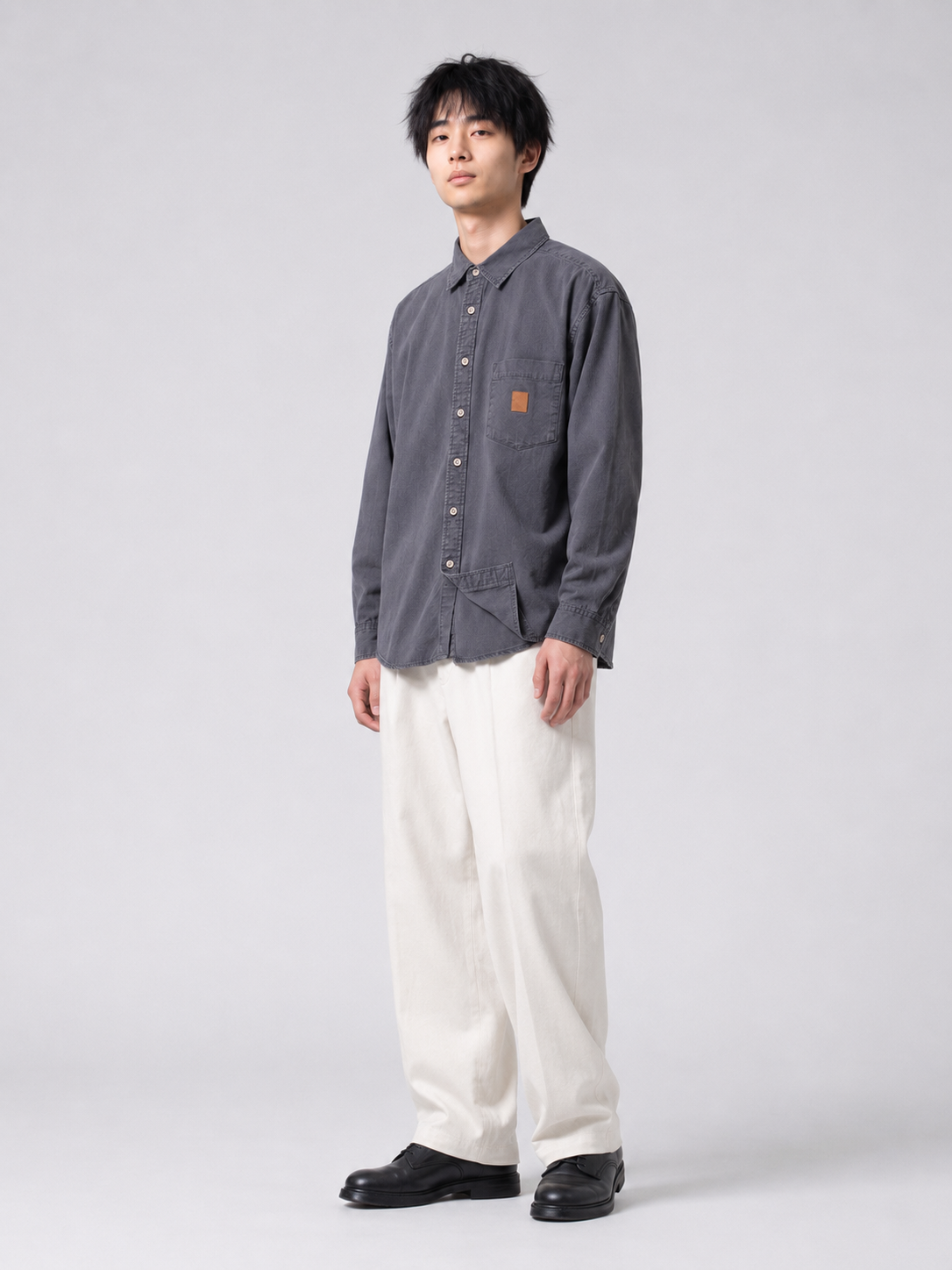 [color:dark-gray] Washed utility shirt in dark gray, model three-quarter view