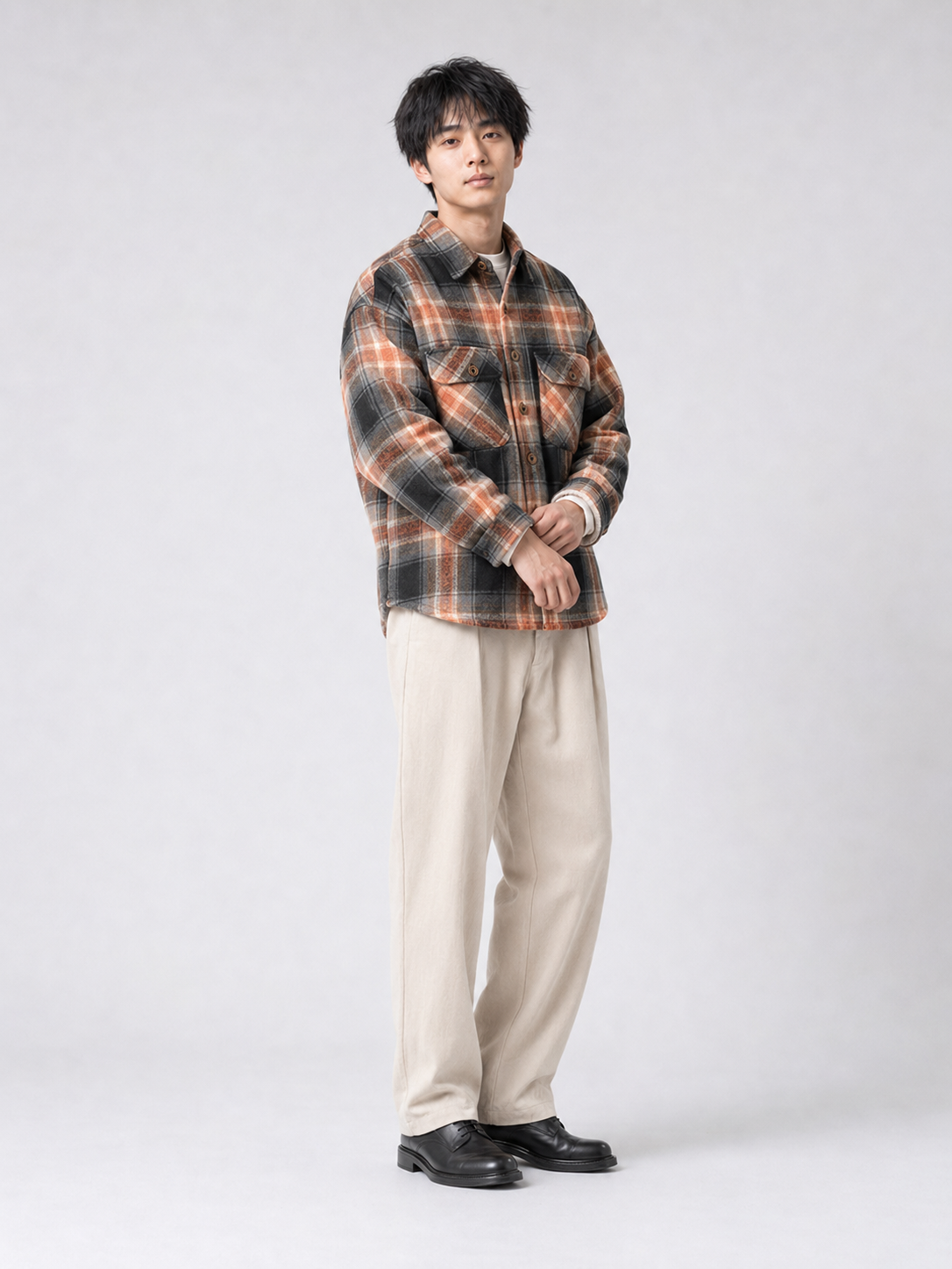 [color:black-orange-grid] Fleece-lined plaid shirt jacket in Black Orange Grid, model 3