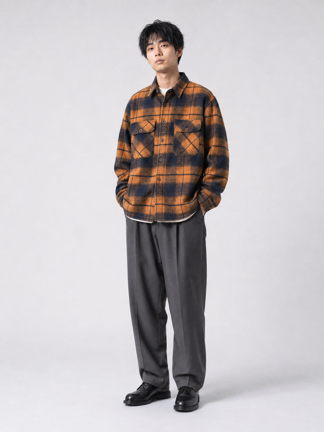 [color:blue-and-orange-grid] Fleece-lined plaid shirt jacket in Blue and Orange Grid, model 1