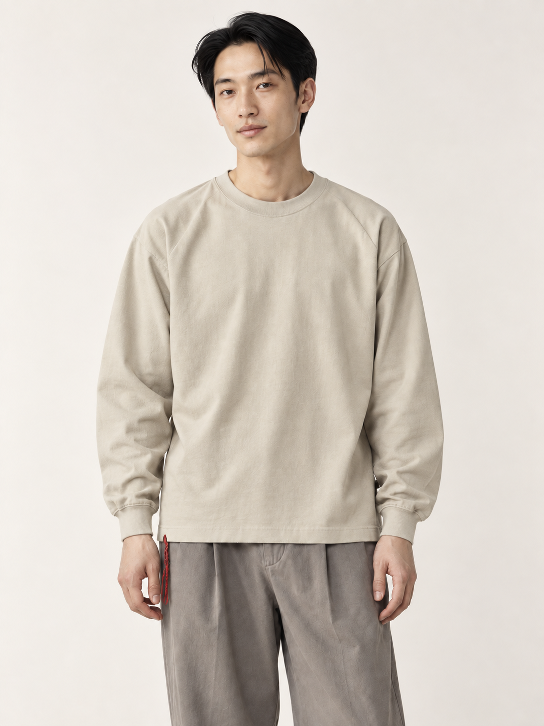 [color:apricot] Washed Long-Sleeve Tee / Heavyweight — half-body model hero