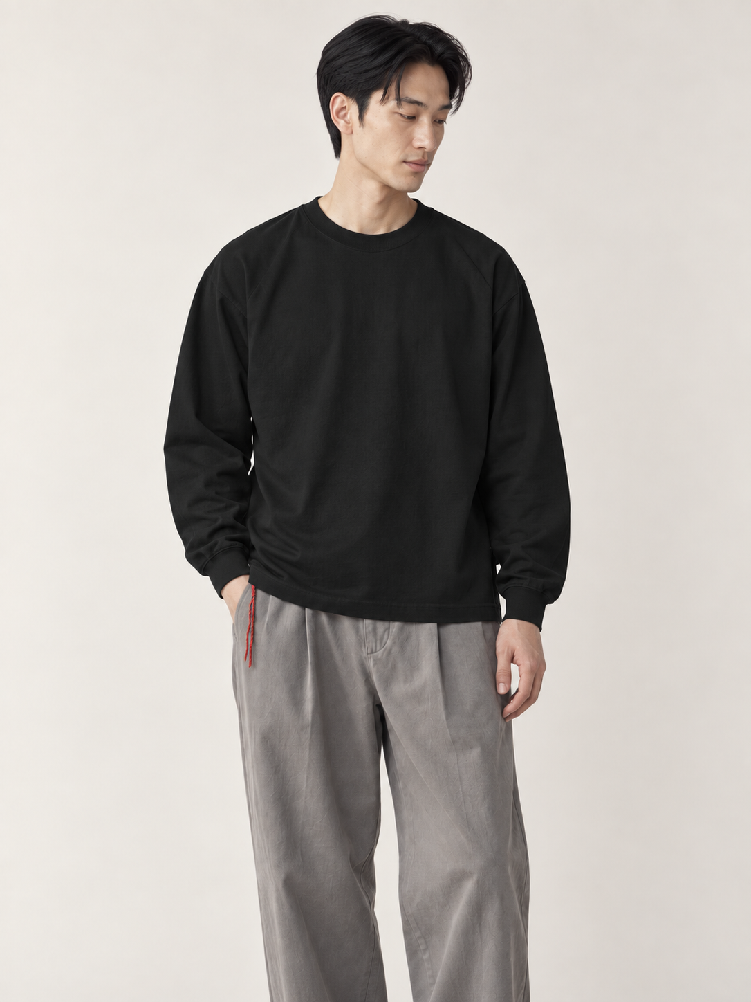 [color:black] Washed Long-Sleeve Tee — model studio view