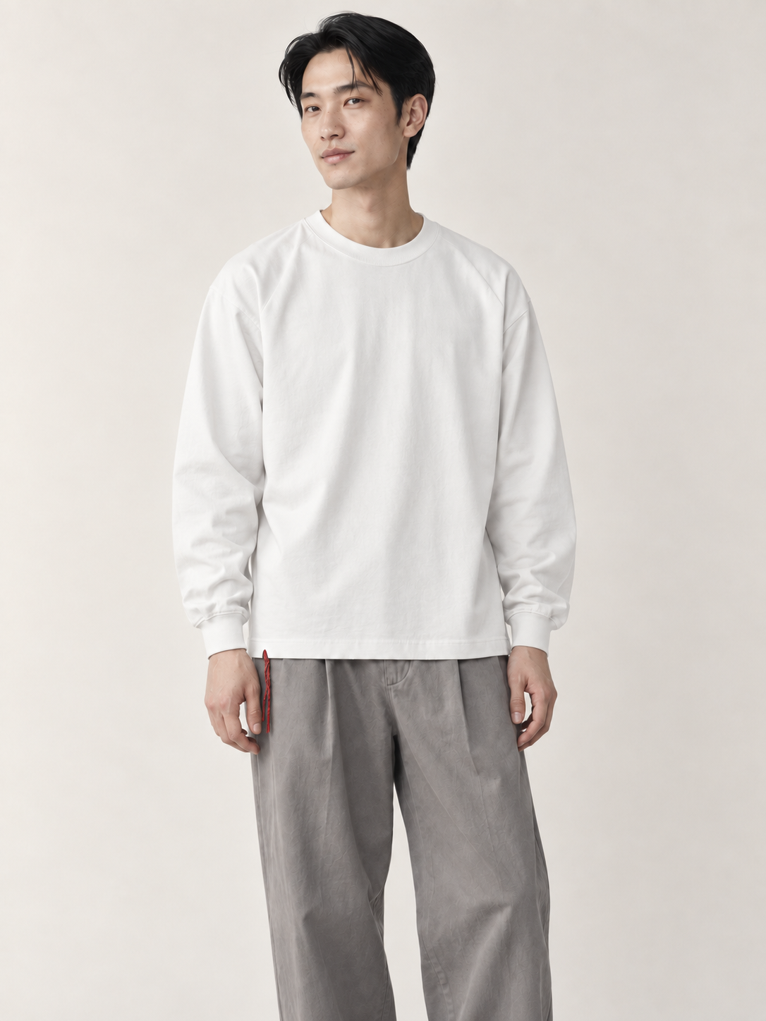 [color:white] Washed Long-Sleeve Tee — model studio view