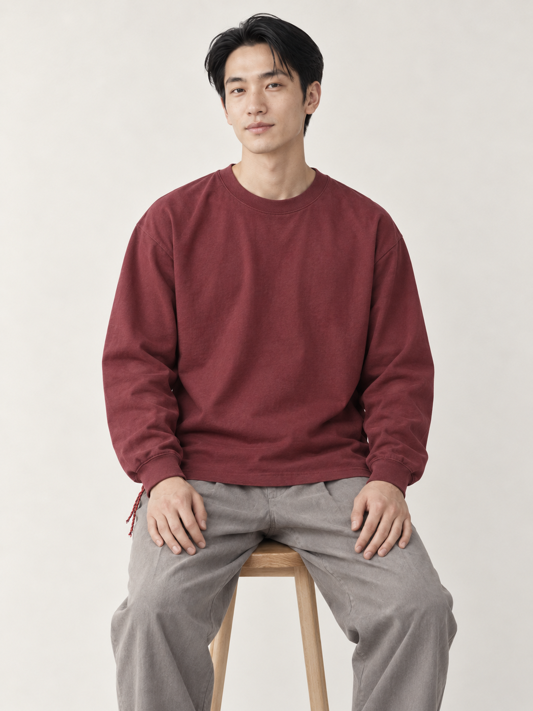 [color:wine-red] Washed Long-Sleeve Tee — model studio view