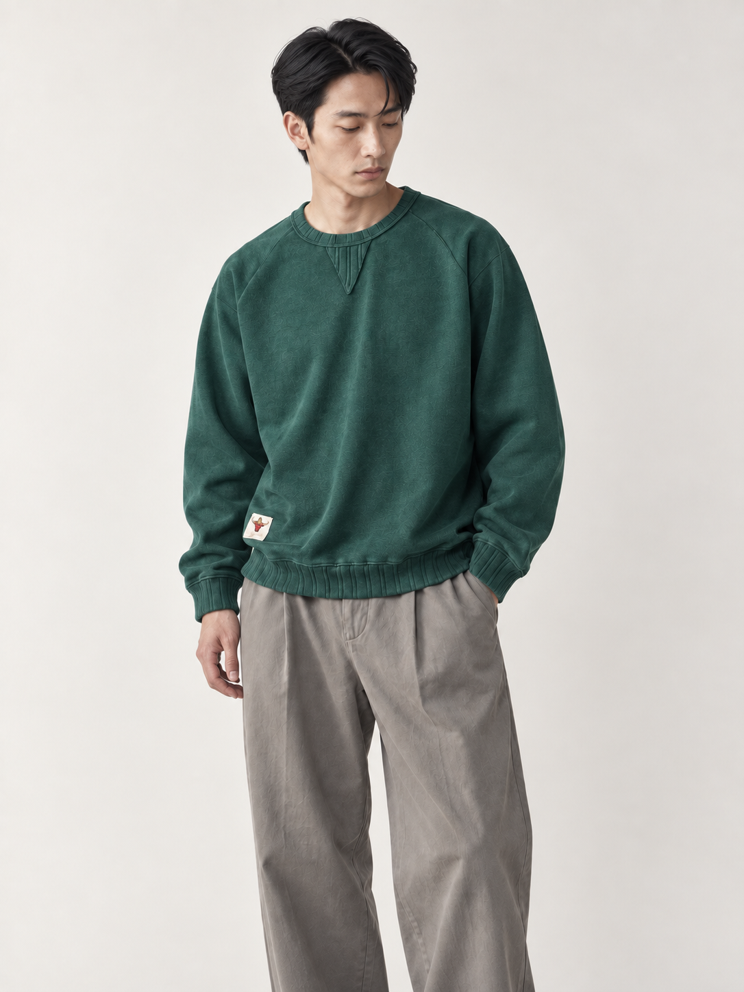 [color:dark-green] Washed Crewneck Sweatshirt — model studio view
