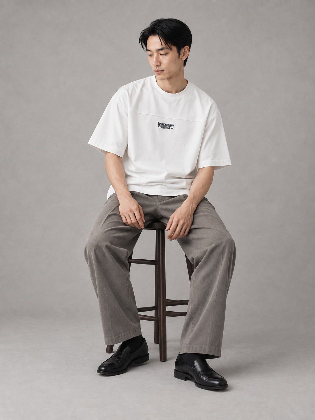 [color:white] Compact-Neck Tee — seated studio model