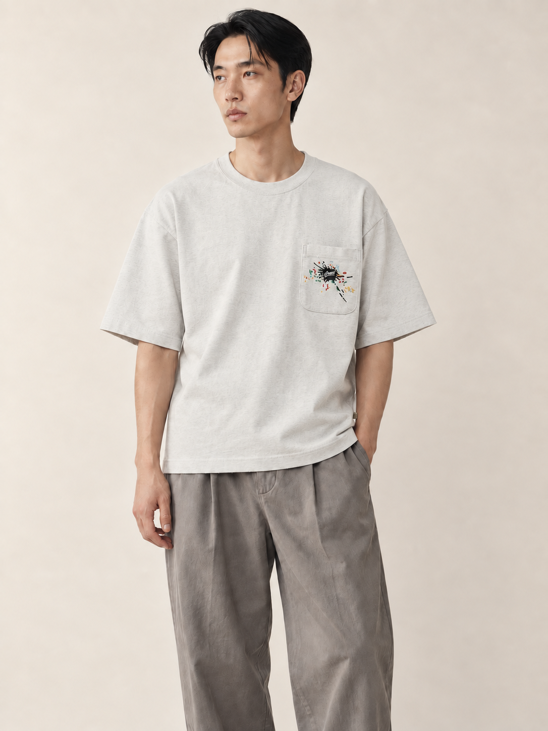 [color:light-gray] Editorial model view — Embroidered Pocket Tee in Light Gray