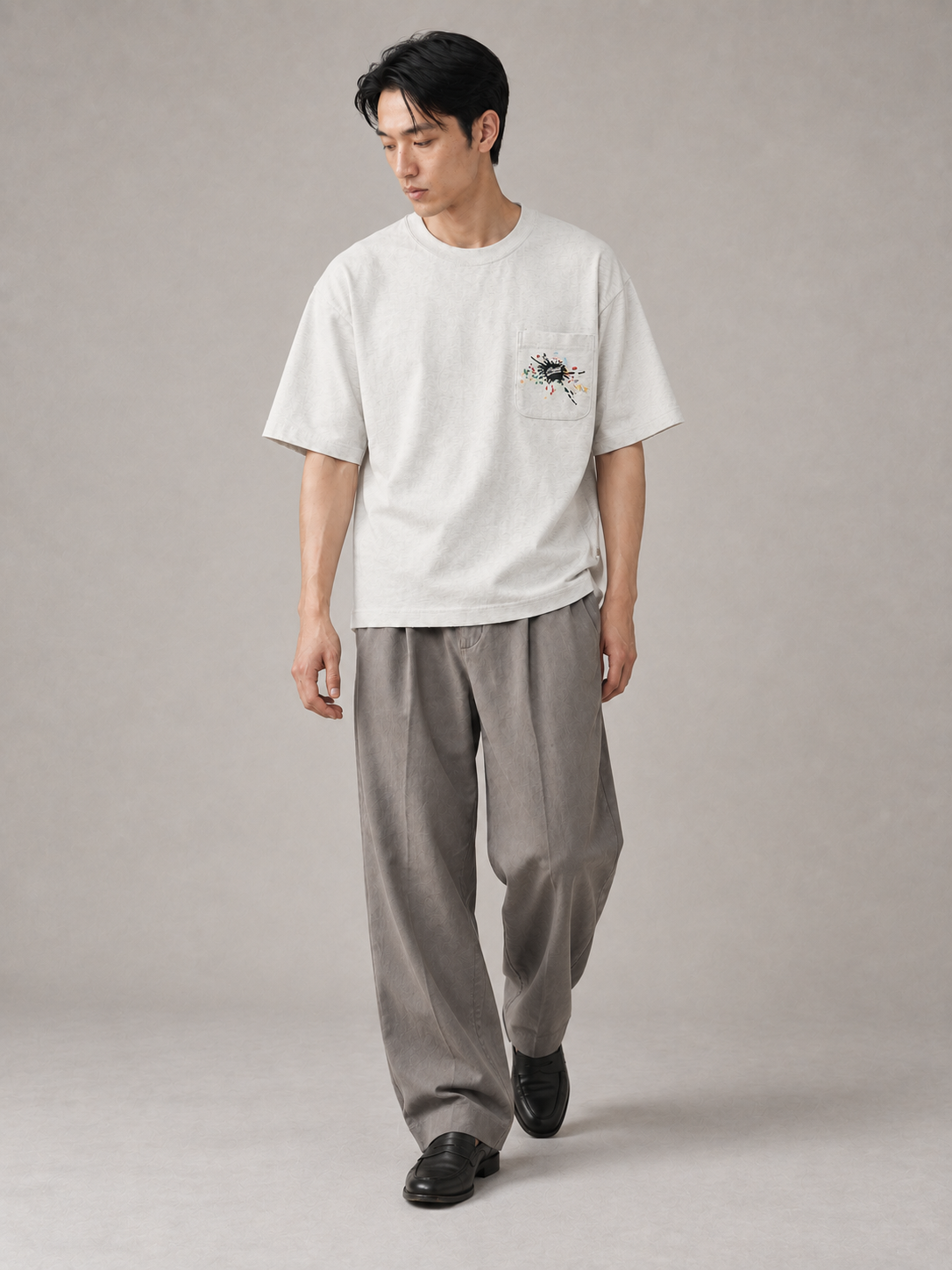 [color:light-gray] Embroidered Pocket Tee — walking studio model view