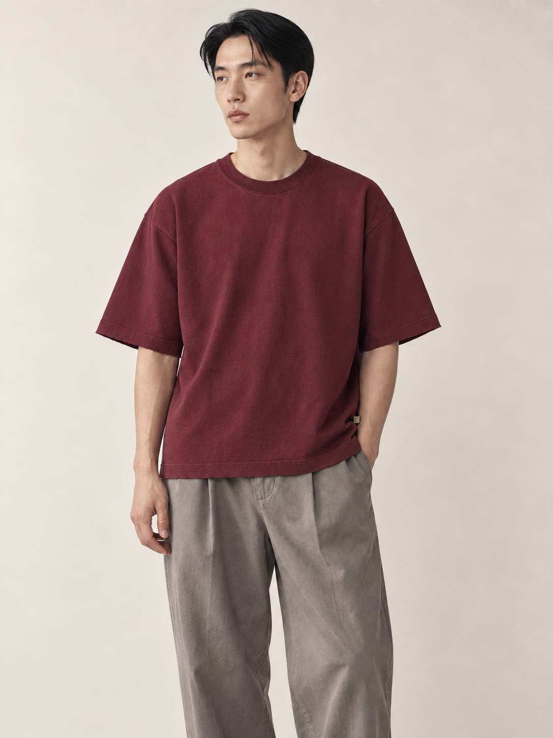 Editorial model hero view — Raw-Edge Crewneck Tee / Cotton in Wine Red