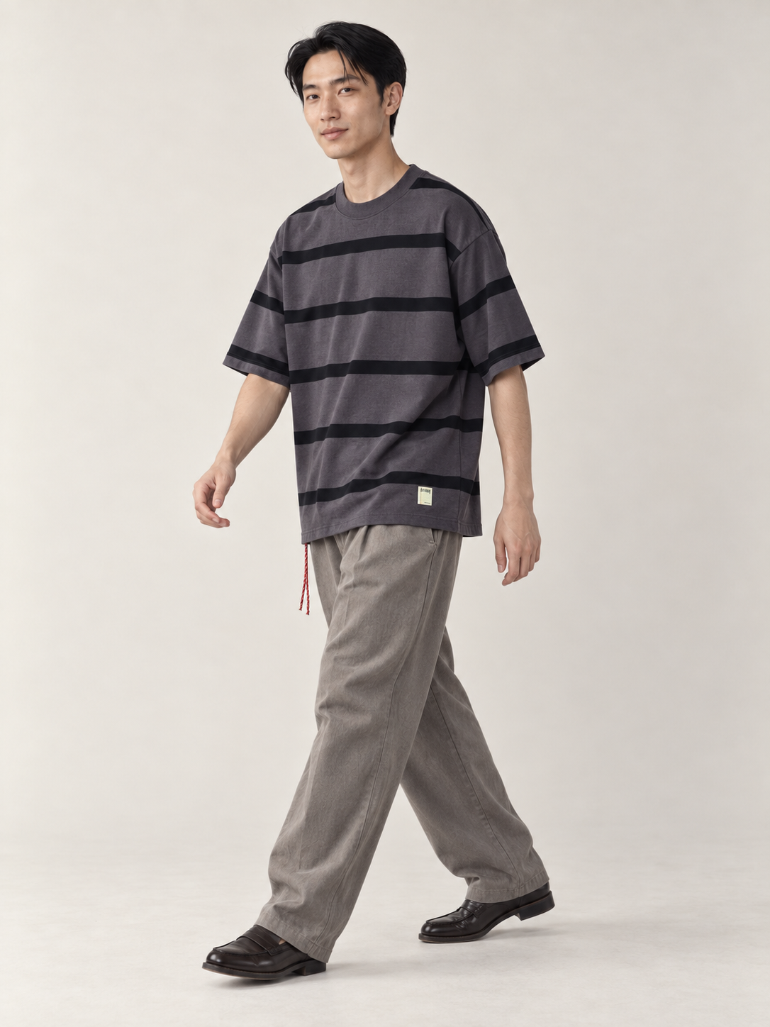 [color:dark-gray] Striped Crewneck Tee — walking studio model