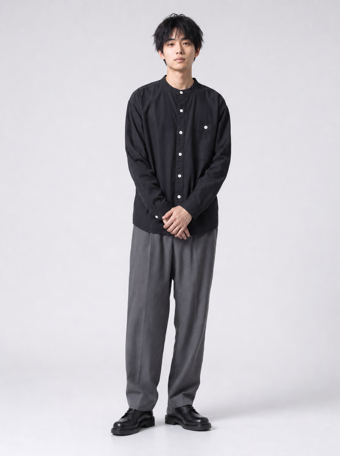 [color:black] Black Henry collar shirt on Japanese male model, calm front pose