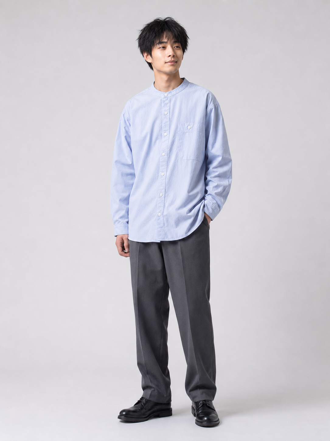 [color:sky-blue] Sky blue Henry collar shirt on Japanese male model, relaxed three-quarter pose