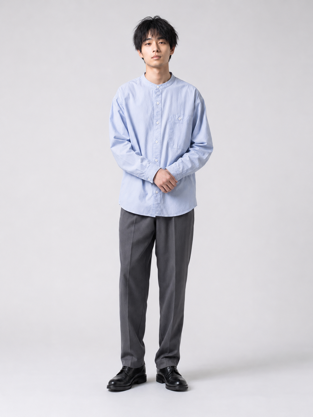 [color:sky-blue] Sky blue Henry collar shirt on Japanese male model, calm front pose