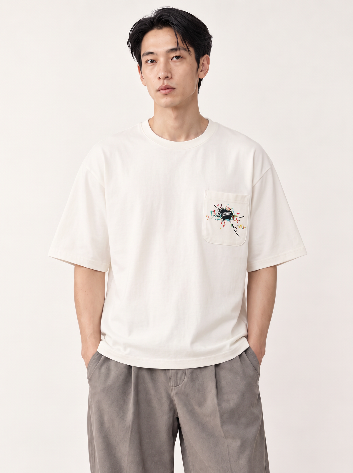 [color:white] Embroidered Pocket Tee — half-body studio model in White