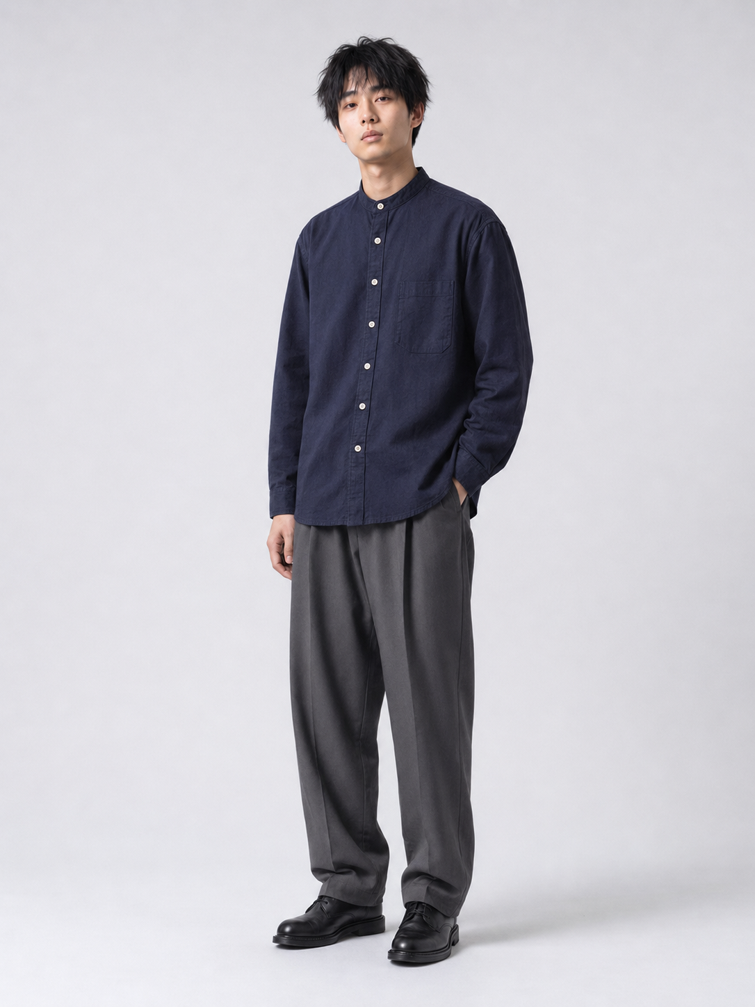 [color:navy-blue-m11] Cotton-linen band-collar shirt in navy blue, model three-quarter view